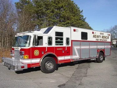 Heavy rescue truck driver-side profile showing full body and compartment line