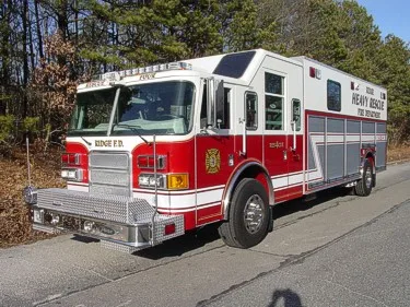 Heavy rescue truck side profile view showing full body parked roadside