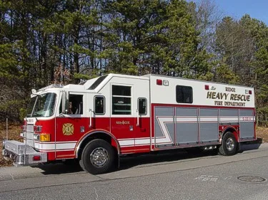 Heavy rescue truck side profile view showing rear body and wheel area