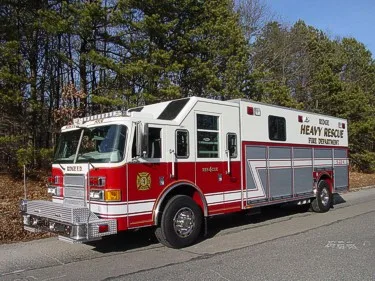 Heavy rescue truck front-left exterior view showing chrome bumper and grille