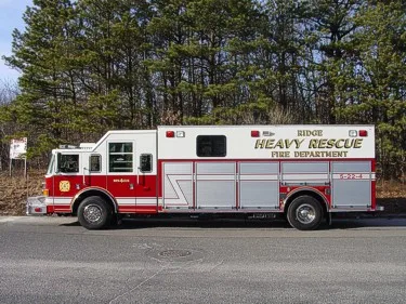 Heavy rescue truck full side profile showing rescue body and rear wheelbase
