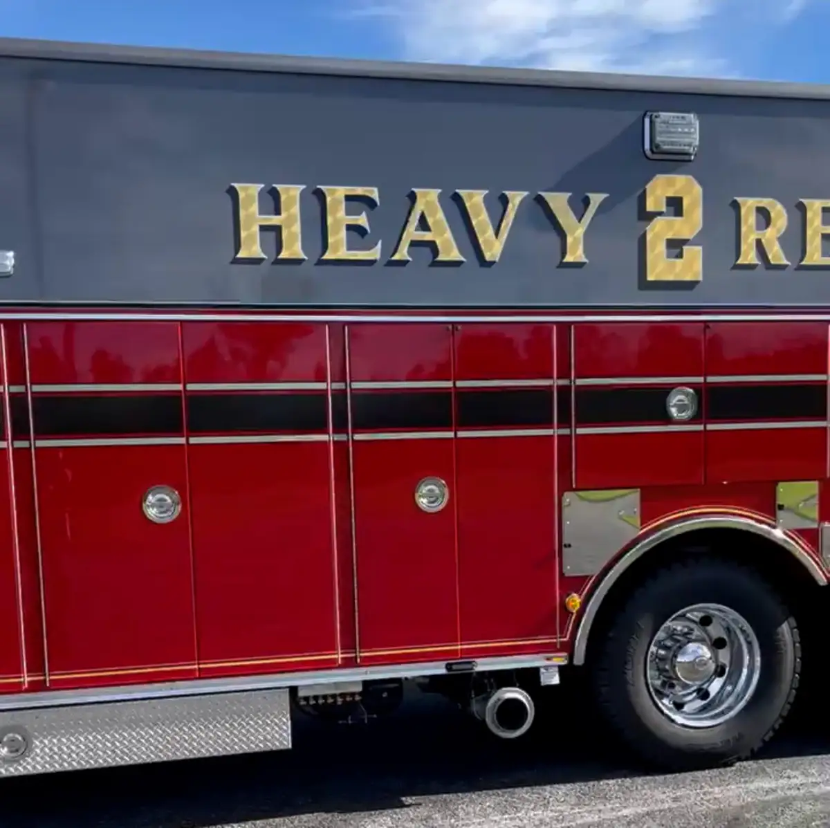 Body side close-up showing heavy rescue lettering and rear wheel section