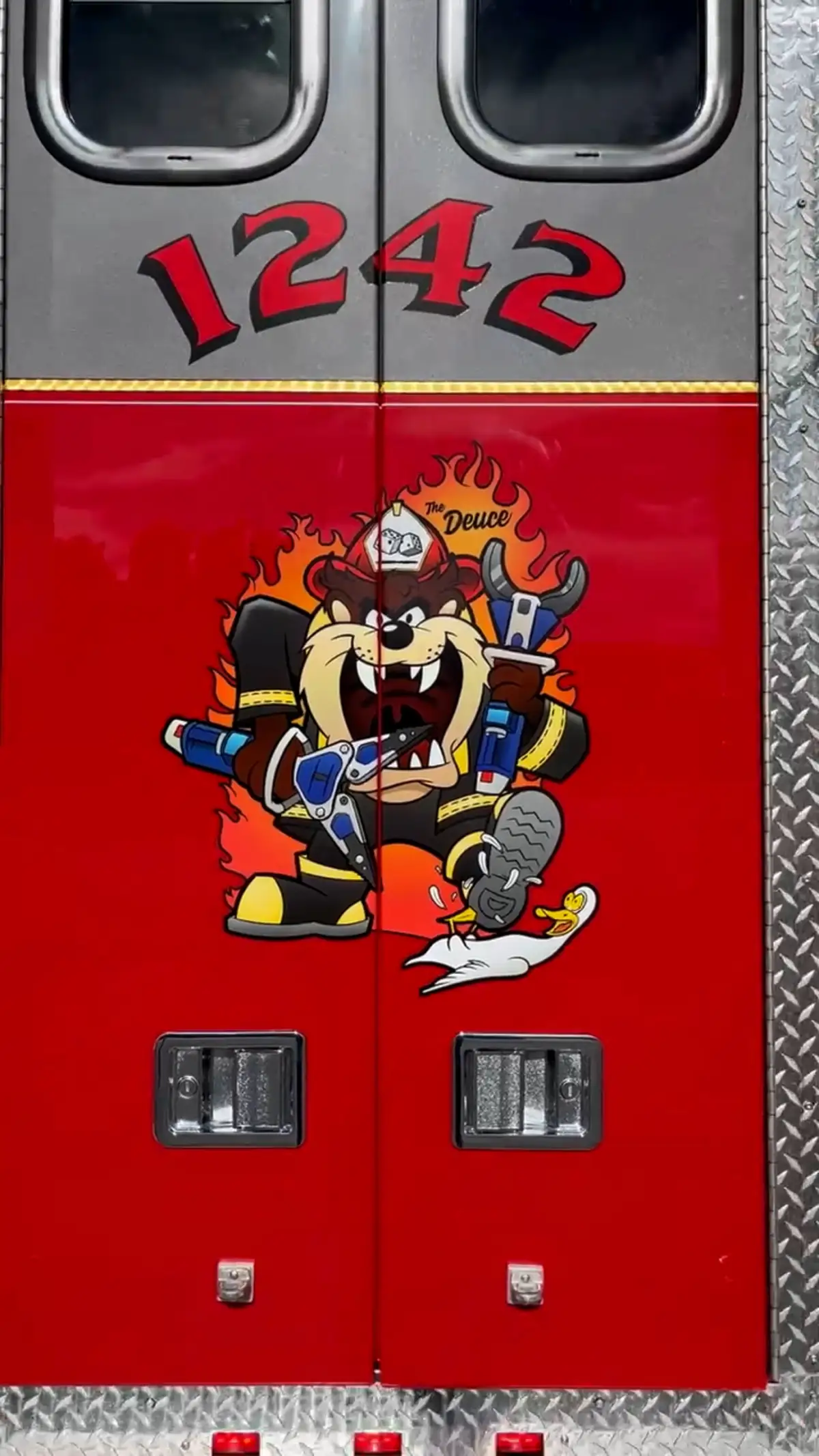 Rear door panel close-up showing unit crest and lower latches