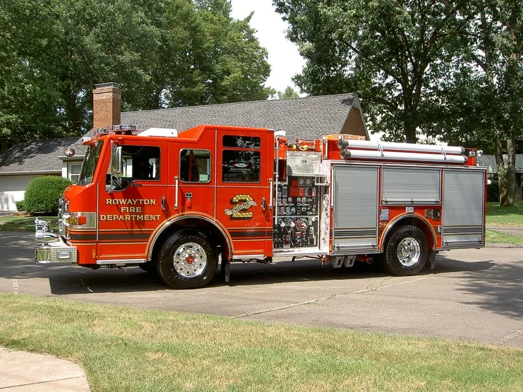 Passenger-side profile view showing side compartments and wheel area