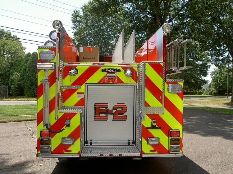 Rear view showing chevrons, rear door panel, and hosebed area
