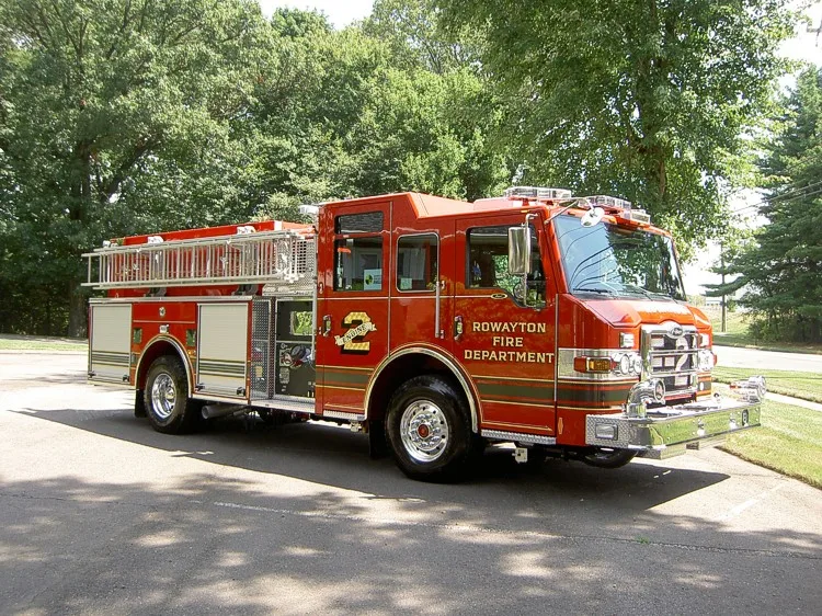 Front-left three-quarter view showing cab, bumper, and side body