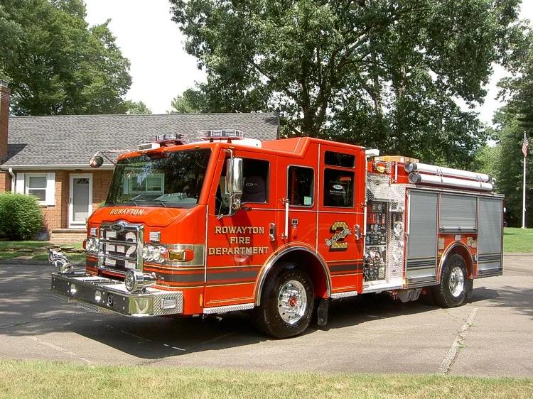 Front-left exterior view showing bumper, cab, and side compartments