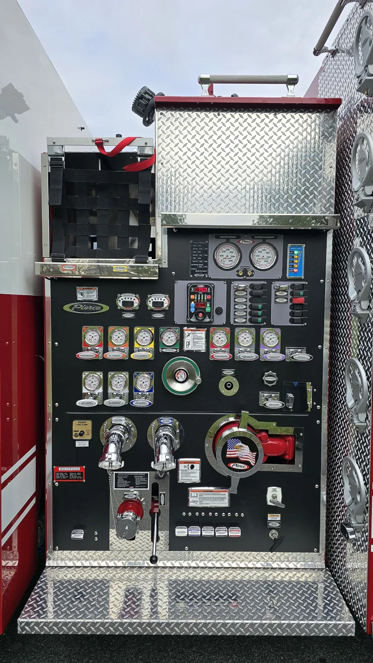 Pump panel close-up showing gauges, valves, intake ports, and control switches