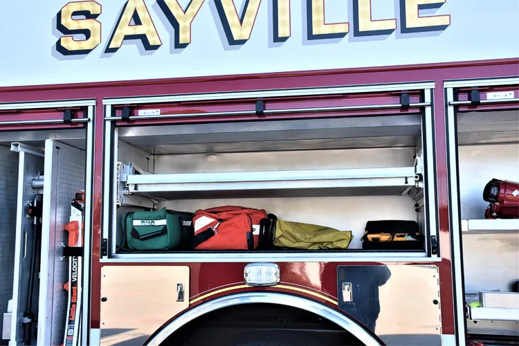 Mid-body close-up showing open side compartments and upper body lettering