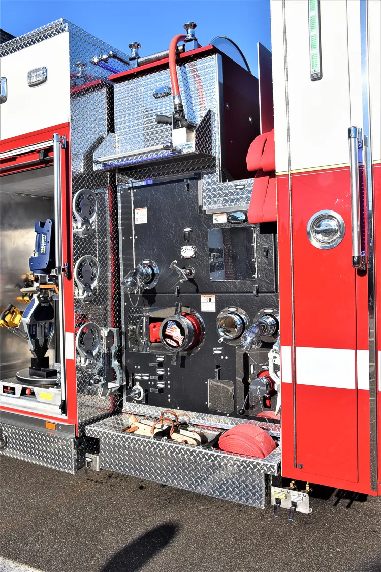 Side pump area close-up showing intake connections, panel controls, and piping