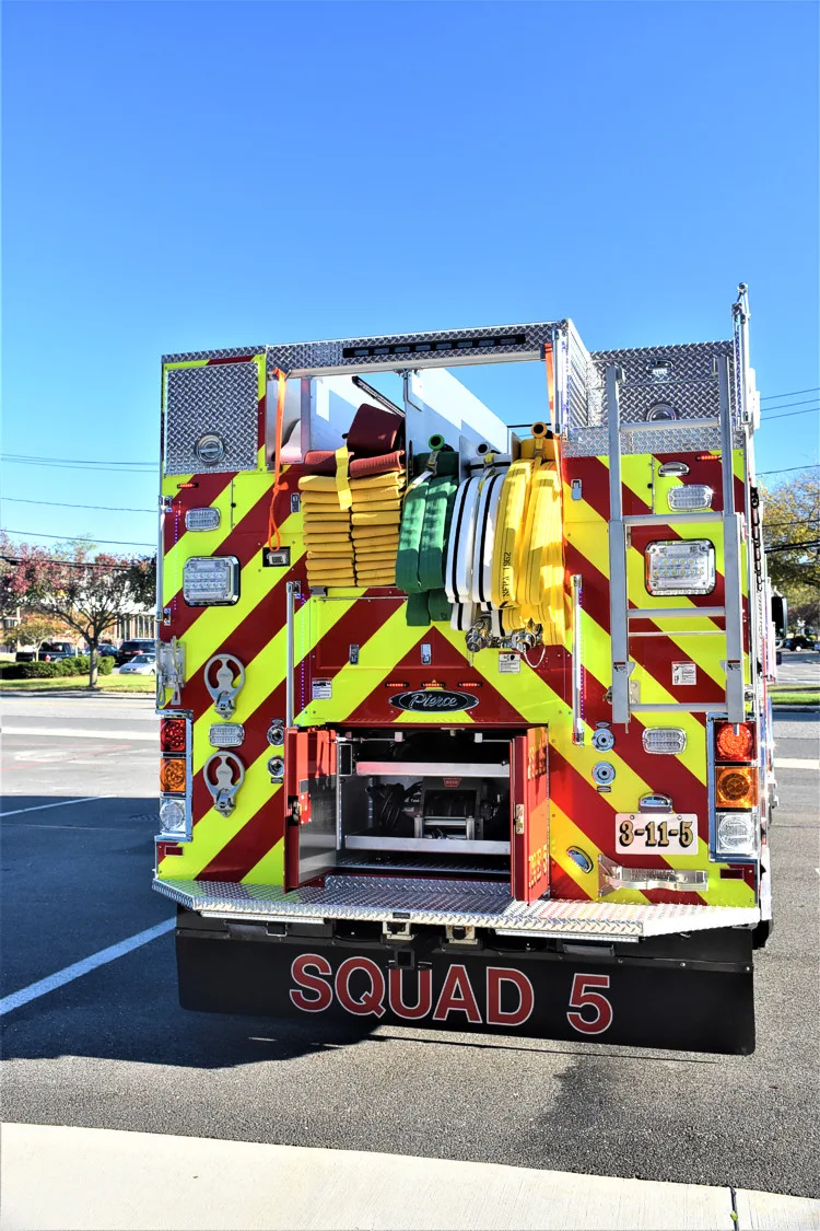 Rear view showing chevrons, rear warning lights, and tailboard area