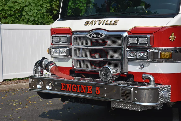 Front bumper close-up showing intake ports, warning lights, and grille detail
