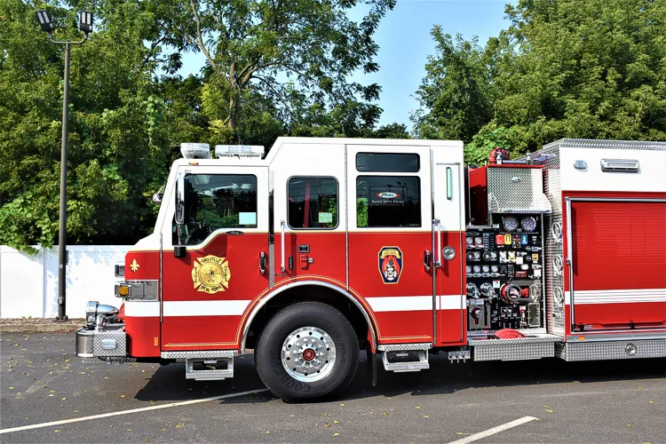 Officer-side profile view showing pump panel section and side compartments