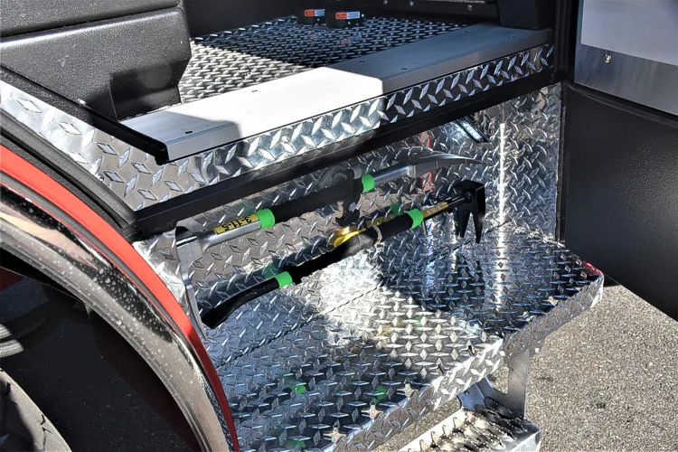 Upper deck detail view showing hosebed grating, couplings, and hose hardware