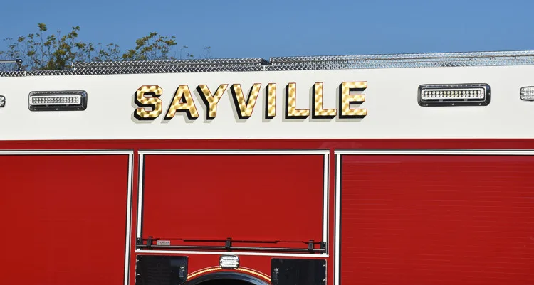 Body lettering close-up showing raised script on a white stripe panel