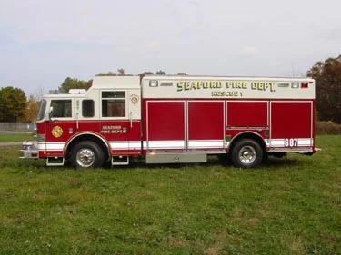 Driver-side profile view showing long body compartments and wheel area