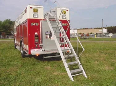 Rear-right view showing rear body, deployed ground ladder, and wheel area