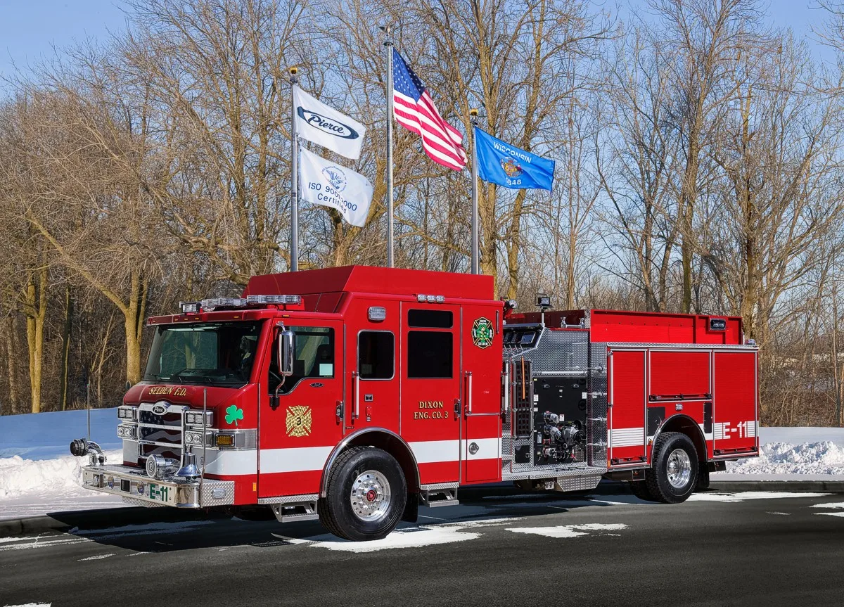 Front-left profile of another matching pumper with side pump panel area and rear compartments visible.
