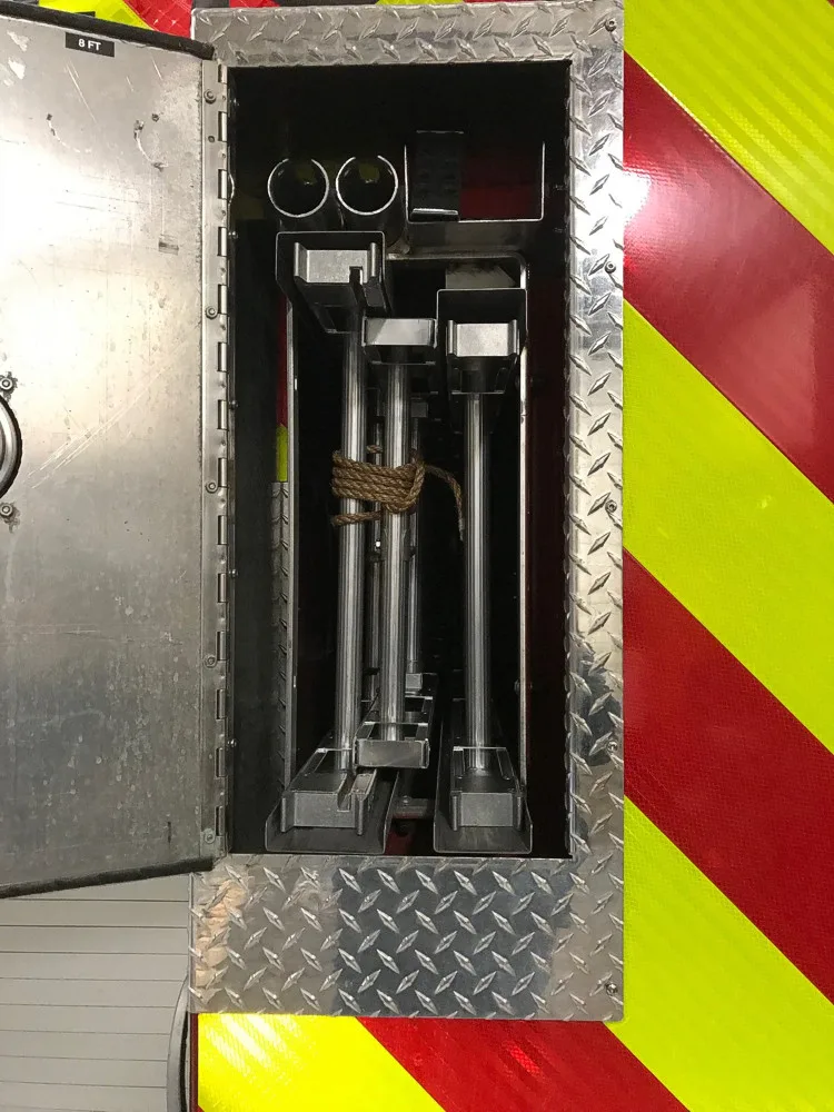 Rear center compartment close-up showing mounted tools and brackets