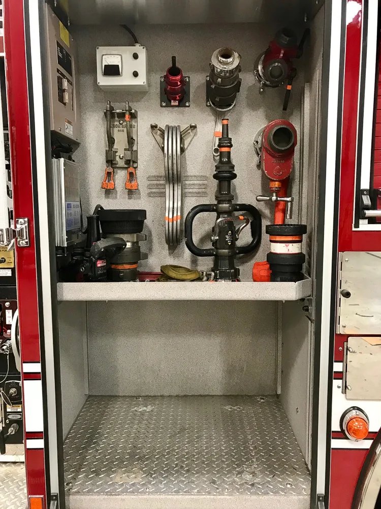 Open side compartment showing pump controls and intake valves