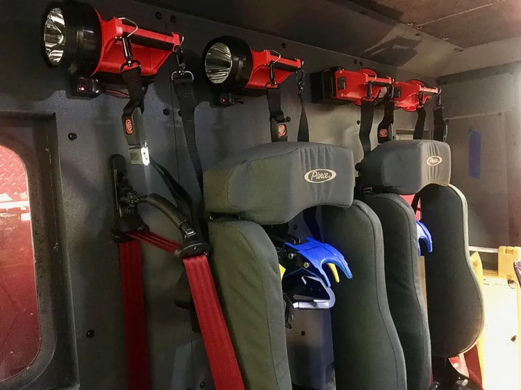 Rear crew seating close-up showing SCBA seat backs and restraints