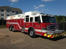 Front-left exterior view showing bumper, cab, and long rescue body