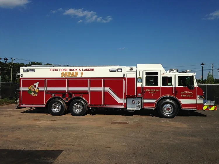 Driver-side profile view showing long wheelbase and side body panels