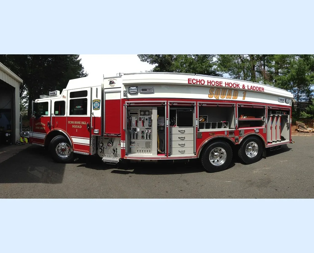 Driver-side profile with open compartments showing shelves and tool storage