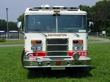 Front exterior view showing grille, bumper, and warning lights