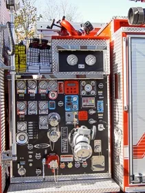 Pump panel close-up showing gauges, valves, and intake controls