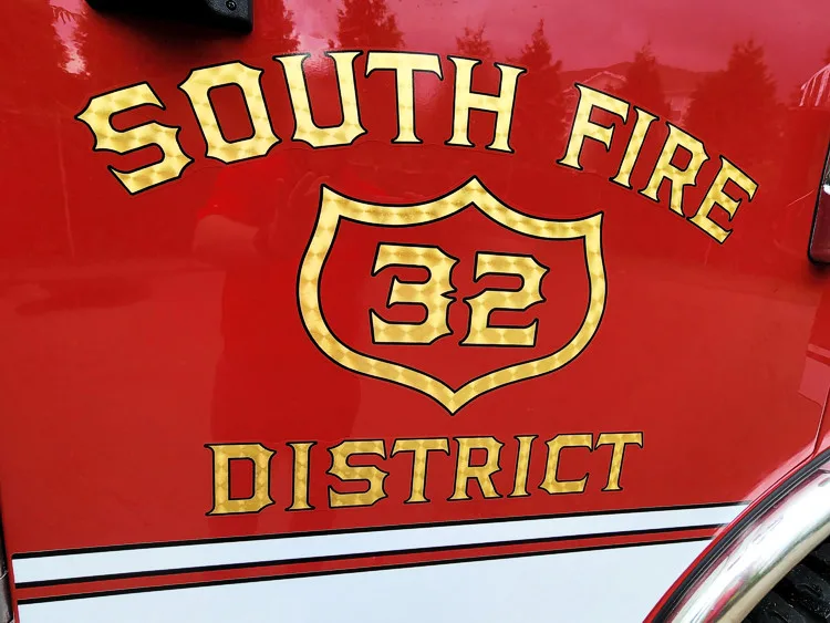 Cab door close-up showing raised district lettering and unit number