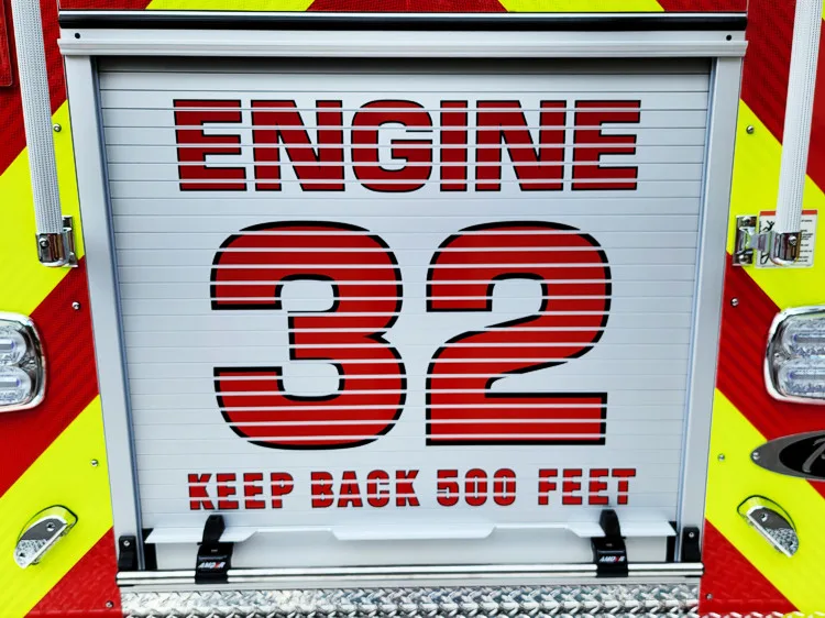 Rear panel close-up showing large engine number and warning text