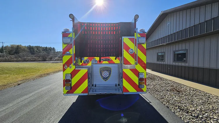 Rear view showing chevrons and centered rear panel with crest