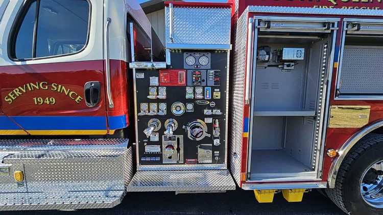 Pump-side compartment view showing controls, gauges, and open side bay