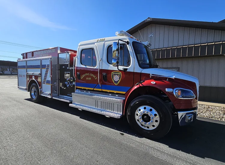 Driver-side profile view showing pumper body and rear wheel area