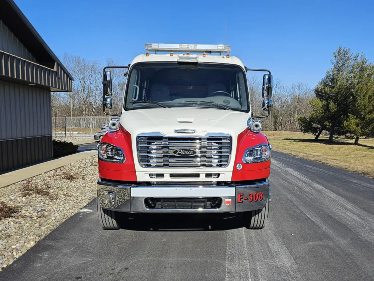 Head-on front view showing grille, bumper, and warning lights