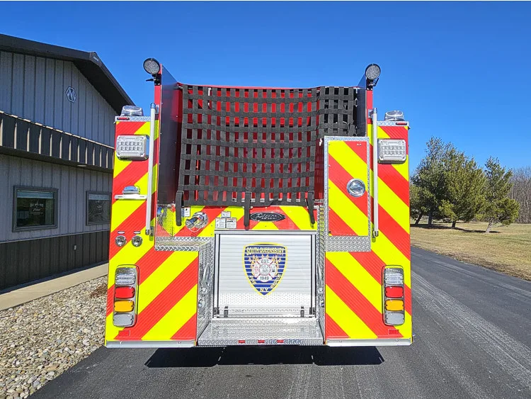 Rear view showing red-and-yellow chevrons and upper hosebed opening