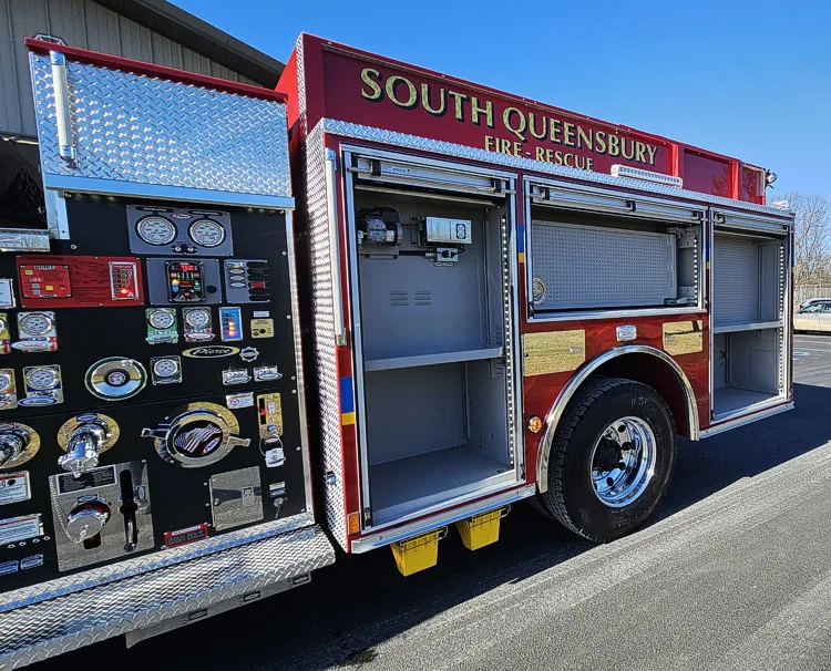 Pump-side profile with open compartments showing gauges and shelf storage