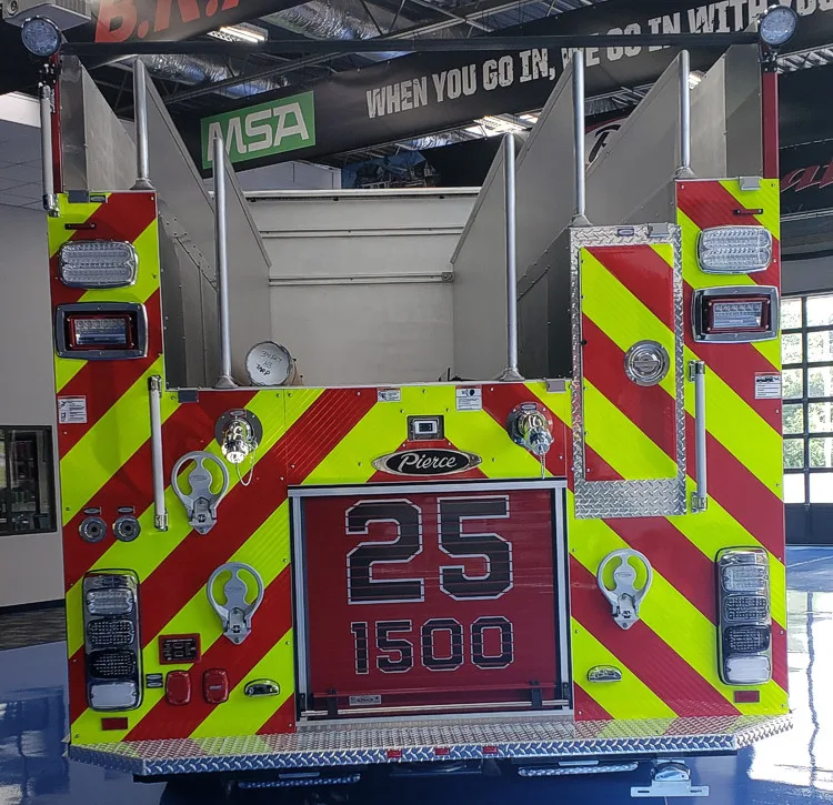 Rear view indoors showing chevron striping and upper hosebed opening