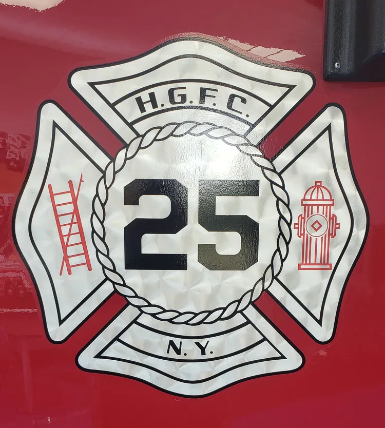 Cab door emblem close-up showing crest graphic and number panel