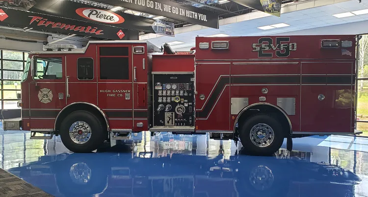 Driver-side profile indoors showing pump panel and side compartments