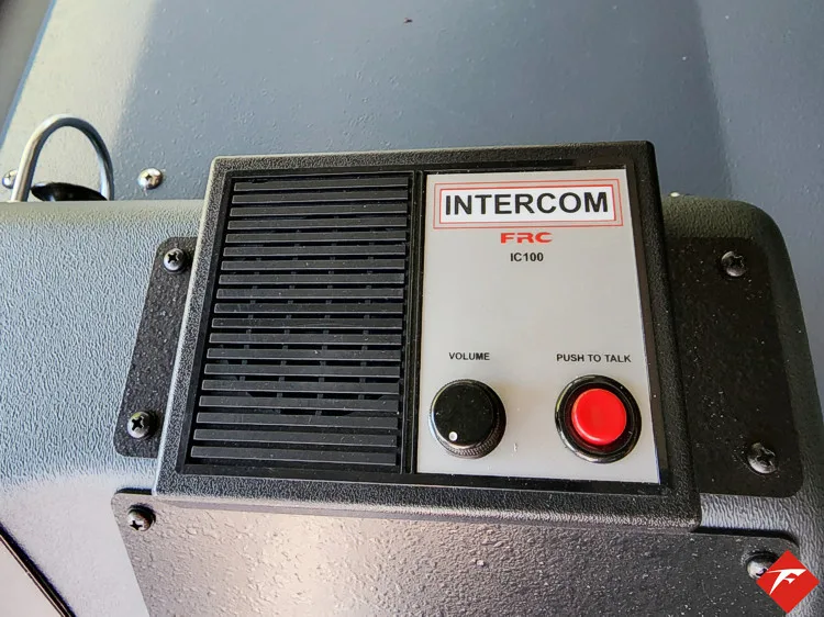 Intercom panel close-up showing speaker grille and call controls