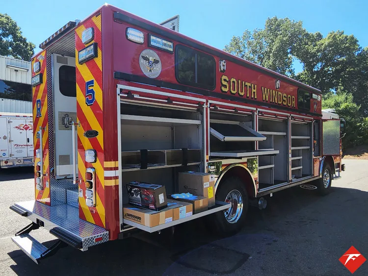 Driver-side profile with open compartments showing tools and shelf layout