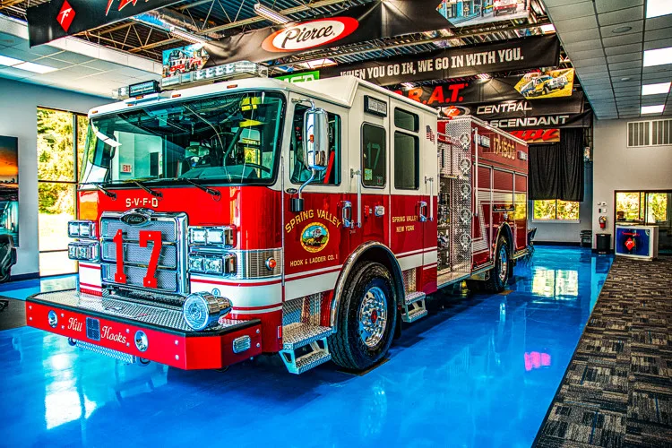 Front-right exterior view indoors showing cab and side body compartments