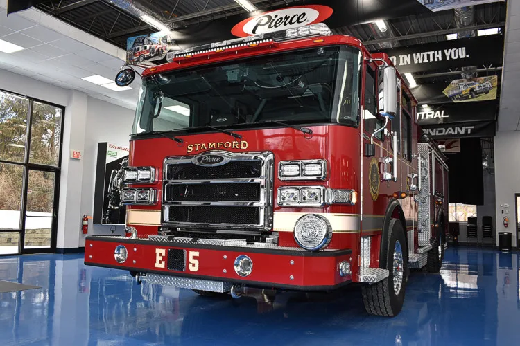Pumper front-left exterior view showing bumper intake and warning lights