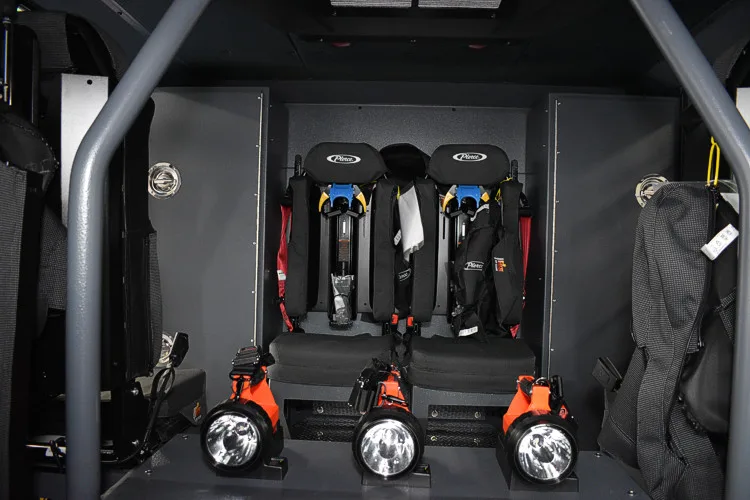 Open cab console area showing mounted radios and cup-holder mounts