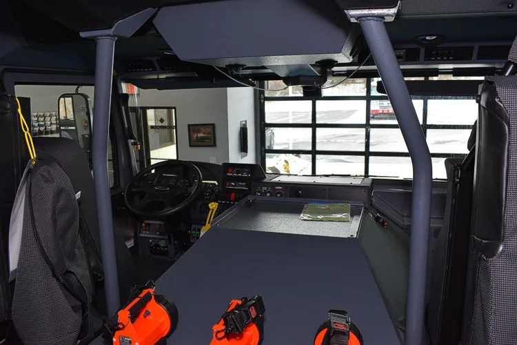 Cab interior view showing rear crew seats and center aisle