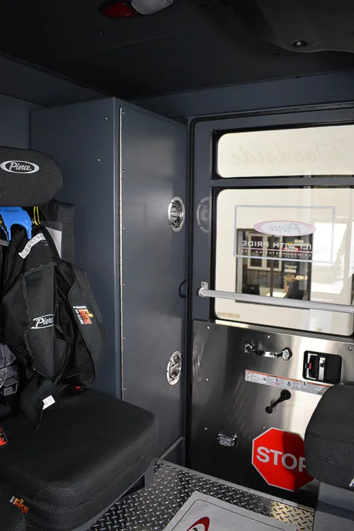 Rear crew area view showing seat mount and cabinet panel