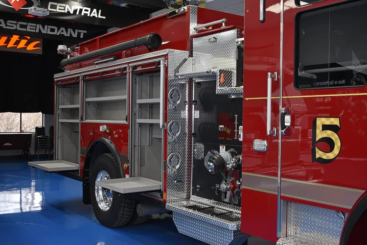 Officer-side rear profile showing open side compartment and wheel area