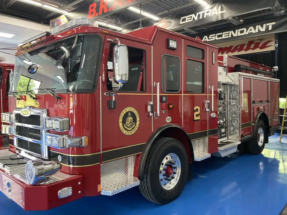 Front-left exterior profile showing pumper cab and side body